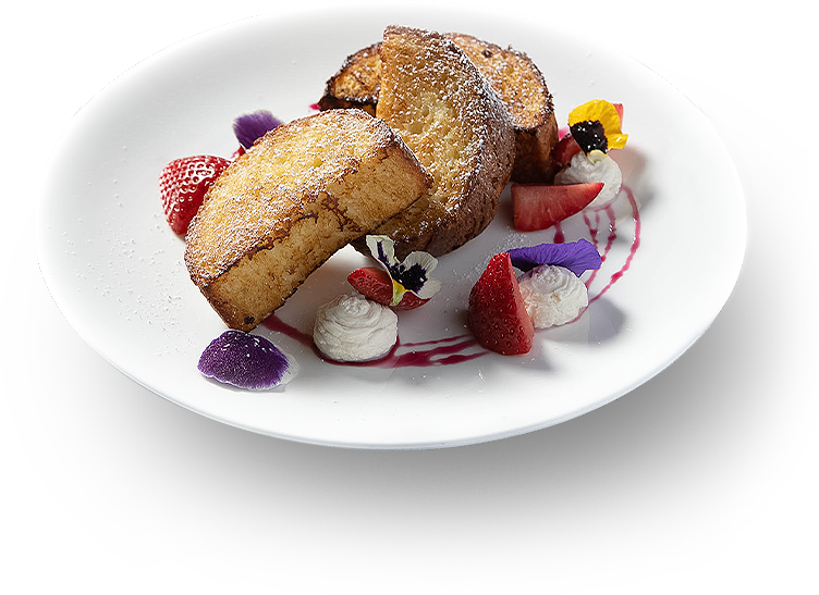 french toast on a plate with powdered sugar, flowers and berries