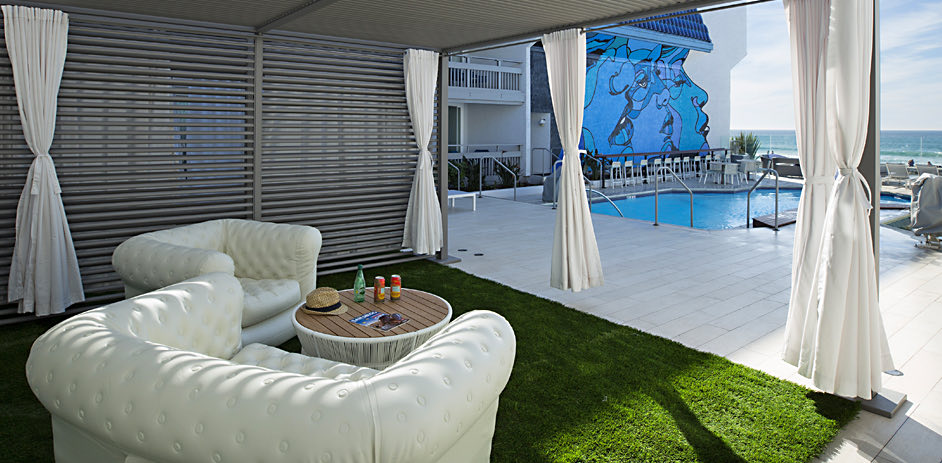 Covered grassy area next to pool 