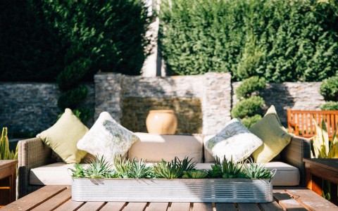 patio lounge sofa with fluffy cushions