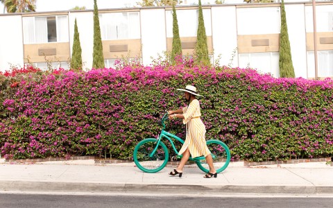 woman riding her bike down the street