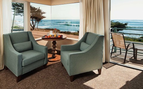 View of two elegant chairs next to a private balcony with seaview