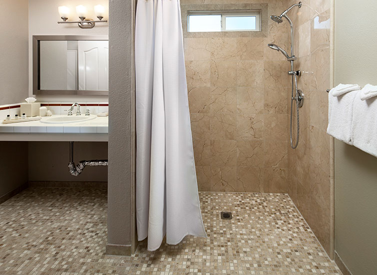 Hotel bathroom with roll in shower