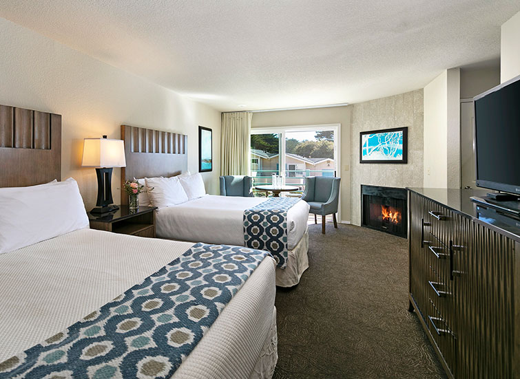 Hotel room with 2 beds and fireplace