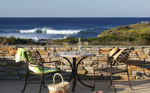 outdoor dining table with view of ocean