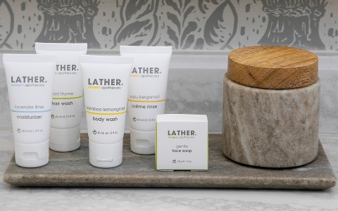 closeup of Lather brand bathroom amenities