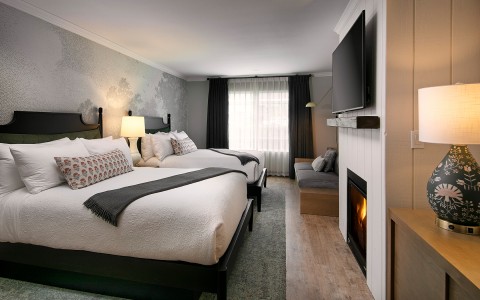2 bed hotel room with fireplace