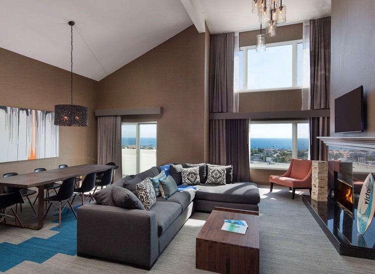large living room with a sectional and a view of the ocean