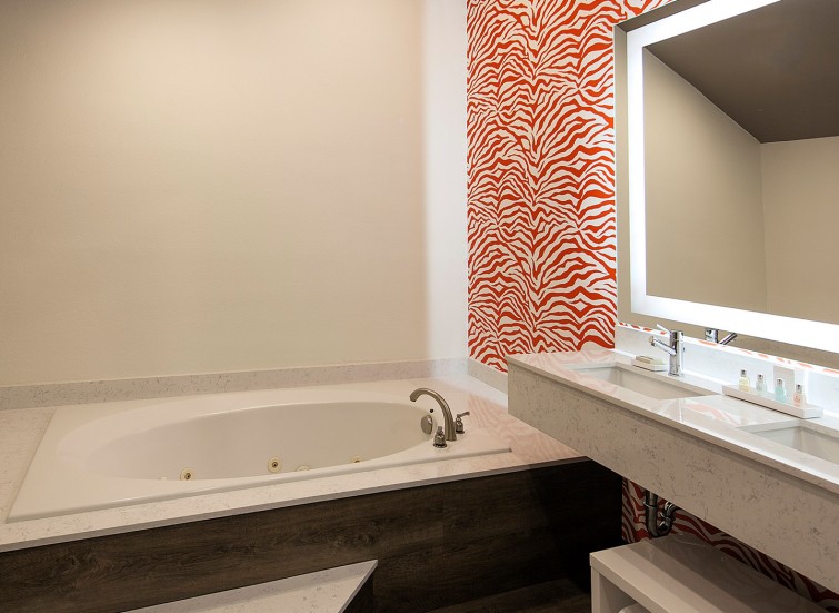 hotel bathroom with red zebra wallpaper 