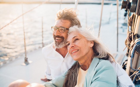 older couple laughing on boat deck