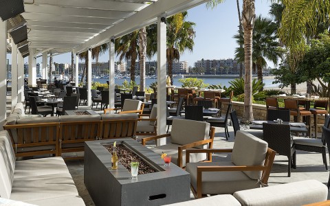 Outdoor dining area with a view of the marina