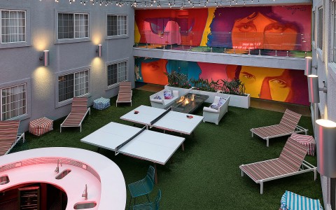 Overhead view of outdoor patio with a colorful mural
