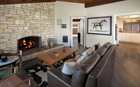 hotel suite living room with long brown leather sectional