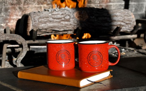 red metal mugs with hotel logo