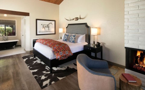 Ranch inspired bedroom with fireplace