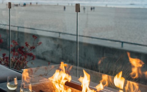 beachfront fire pit with wine