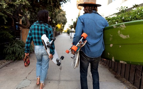 friends wearing plaid on their way to skateboard