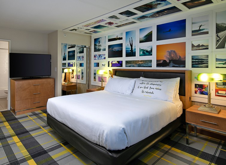 hotel bedroom with tv and nightstand