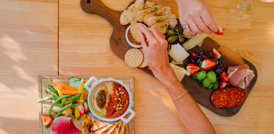 aerial view of a charcuterie board and another plate of fruit