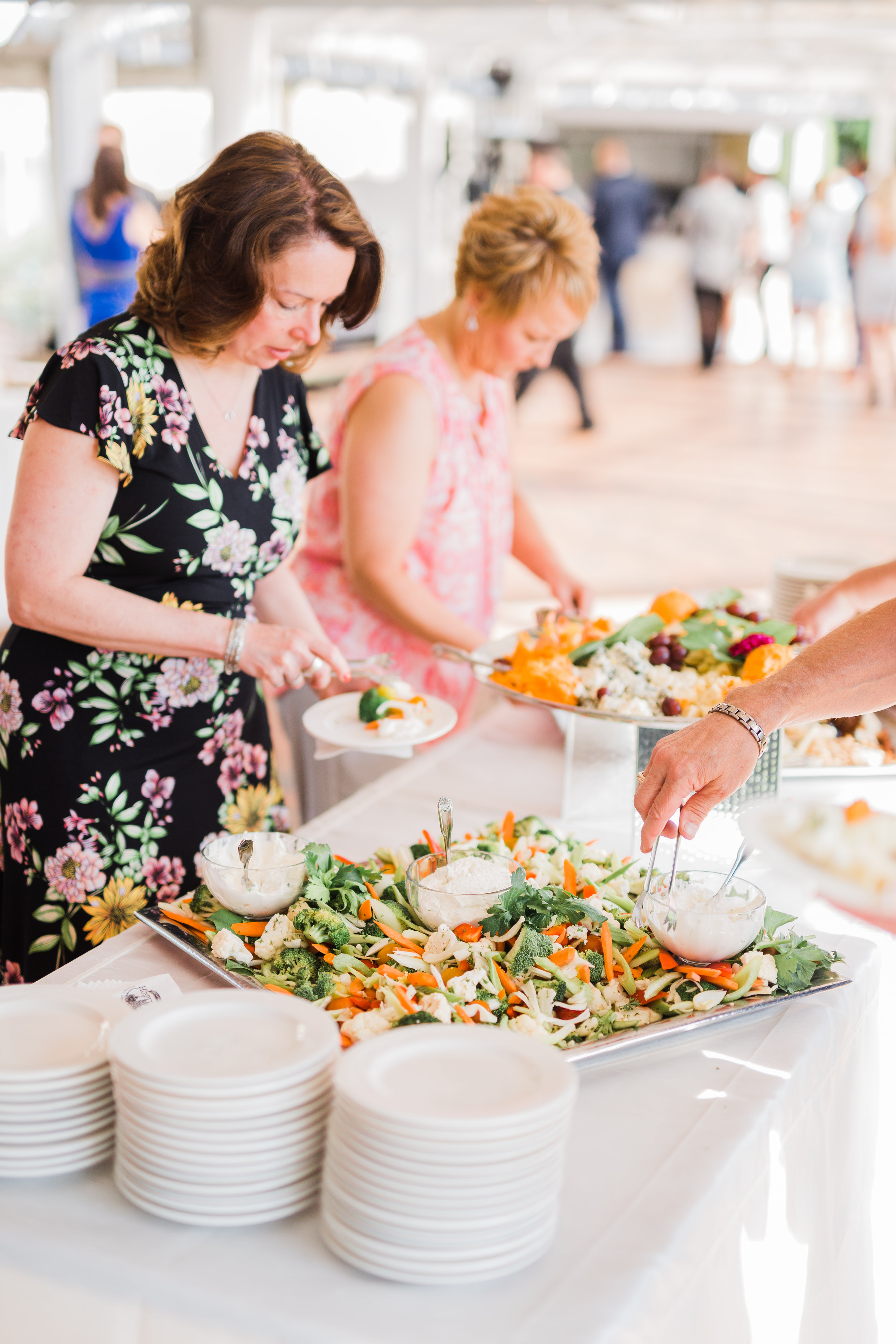 wedding guest selecting food from buffet