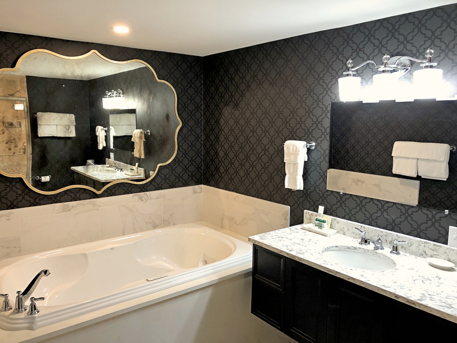 black and white bathroom with large tub 
