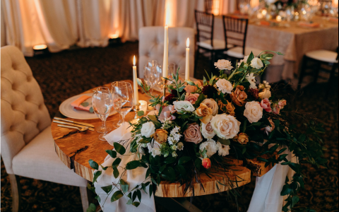 dining table with bouquet of flowers and candels 