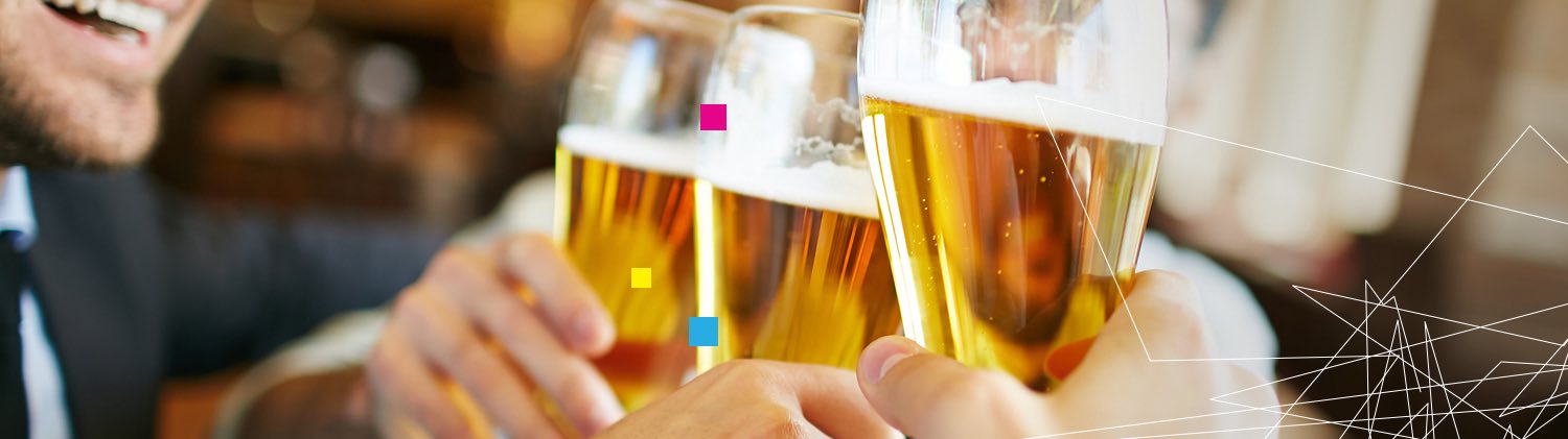 Close up of glasses of beer toasting
