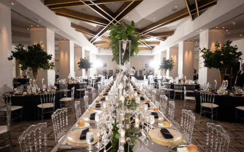 reception setup with large vases and greenery