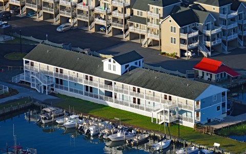 aerial image of the anchor inn during the day with boats in the water 