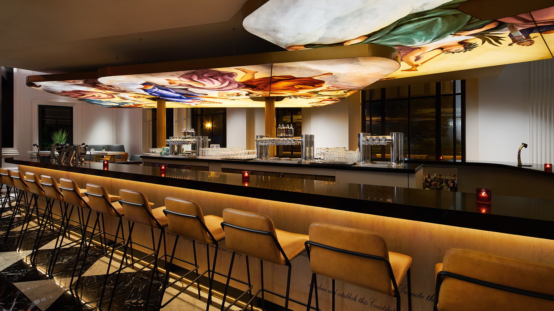 center bar with yellow bar chairs a decorative ceiling lights