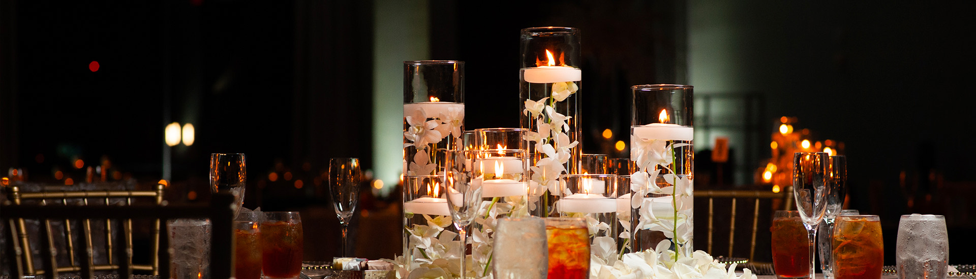wedding table with drinks and candles in the center