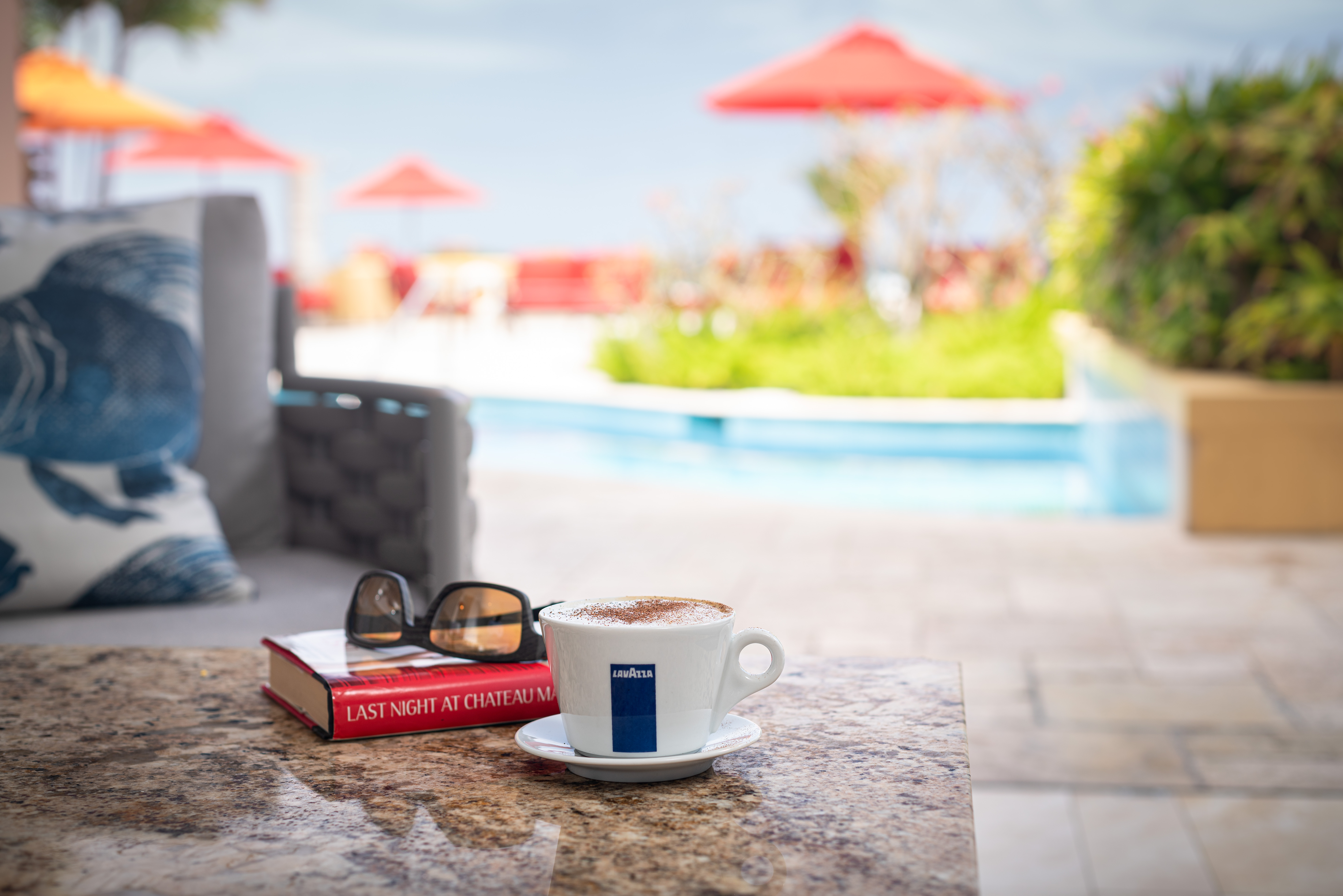 coffee by the pool with beach view