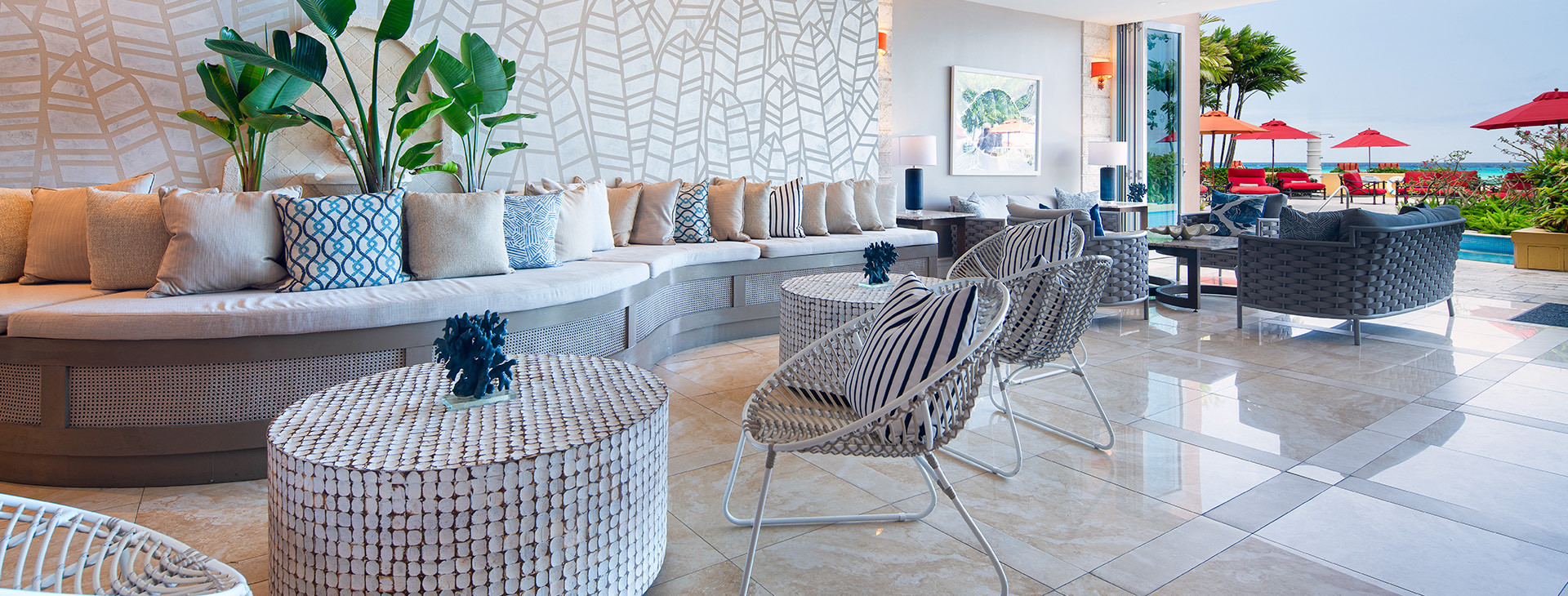 lounge chairs with pillows and umbrellas