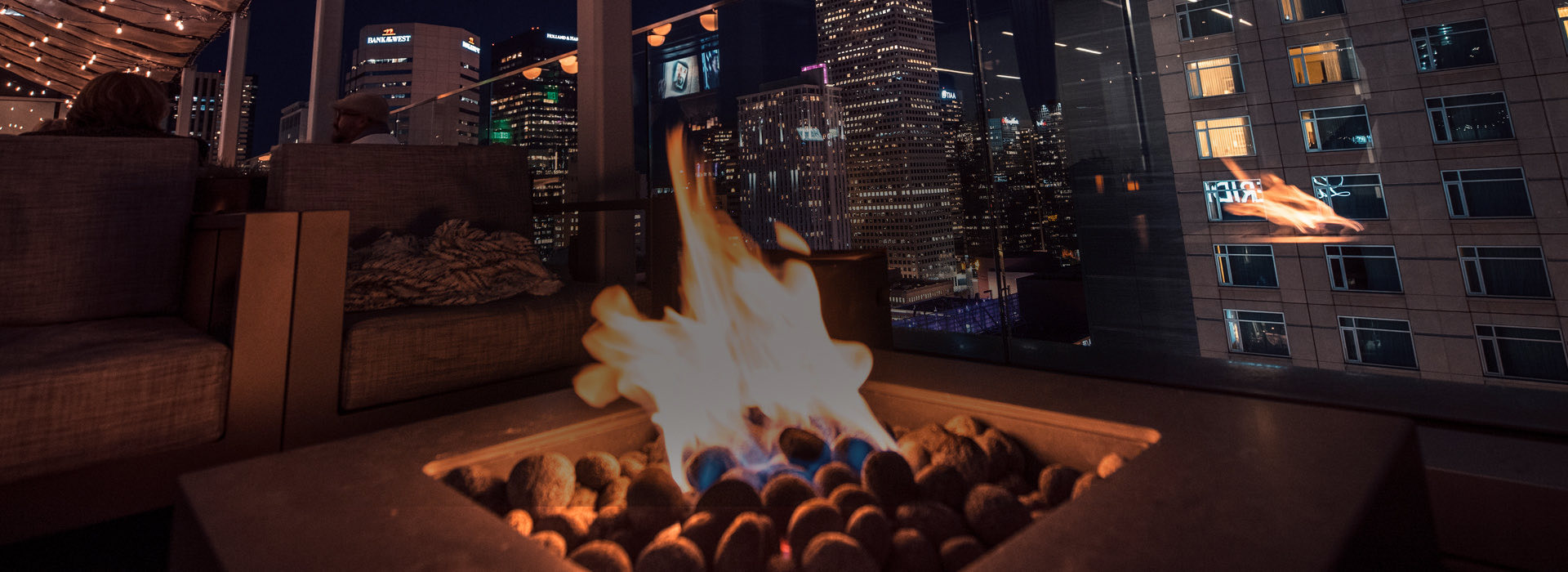 closeup view of a fireplace at the rooftop bar place and the great view from there