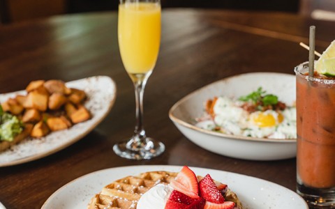 image of breakfast plates with mimosa and bloody mary 