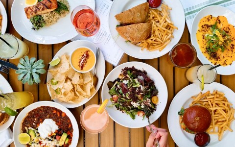 above photo of different dishes already served in the table