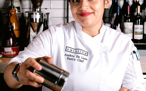 woman pastry chef smiling looking straight to the camera