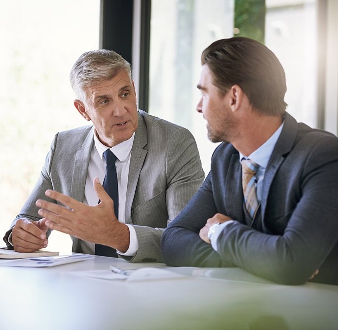 men talking during a business meeting