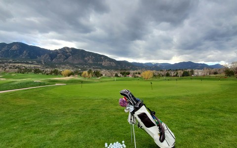 golf clubs and balls on the golf course
