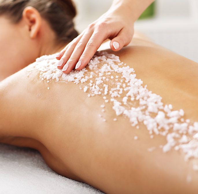 woman getting a massage and spa treatment