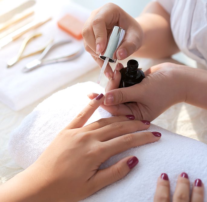 woman getting her nails done