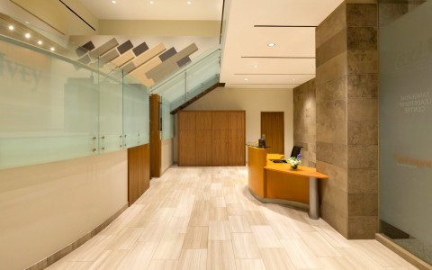 lobby area with wooden floors and the front desk 