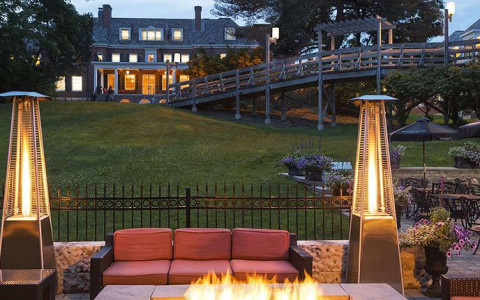Ivey Spencer and an elevated walkway can be seen in the distance from the fire pit patio