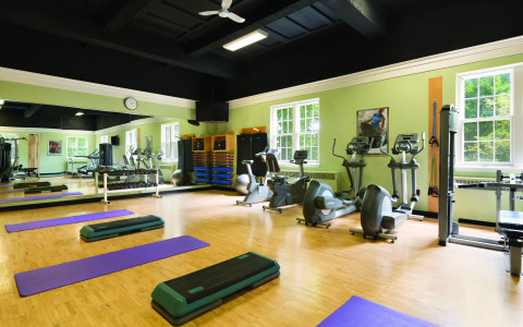 purple mats and exercise tools in a gym
