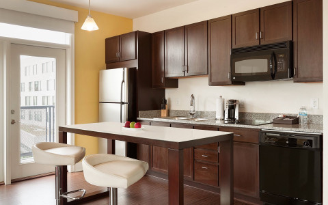 brown kitchen cabinets with granite countertop