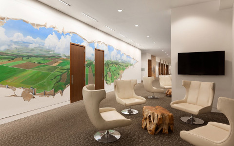 Hotel lobby with Indiana mural on wall