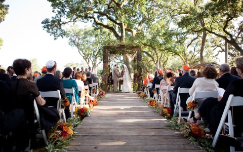 Beautifully decorated wedding ceremony located outside on The Grove