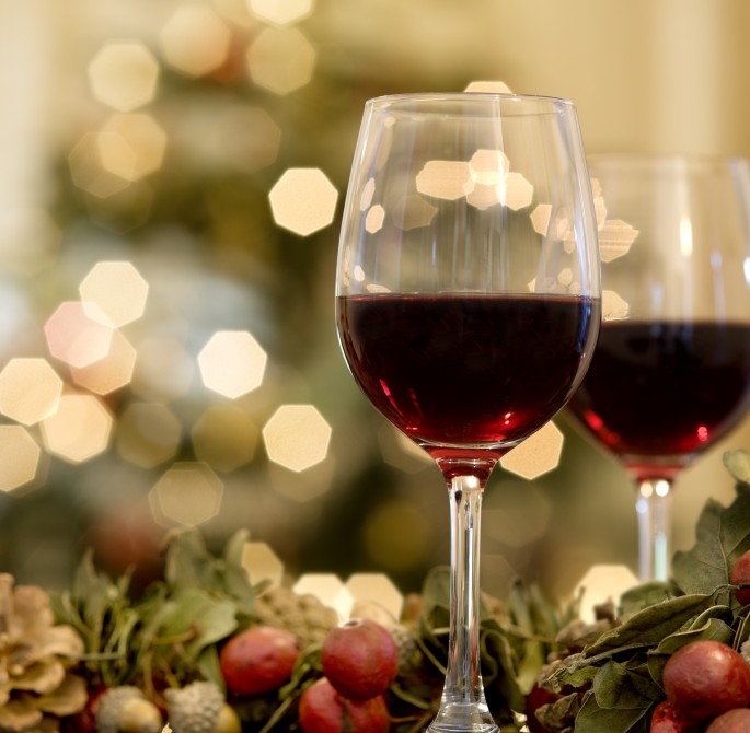 red wine with a holiday festive background 