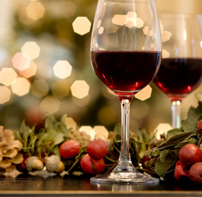 red wine with a holiday festive background 