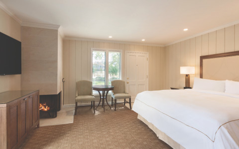 Mansion Estate junior suite with king bed and fireplace