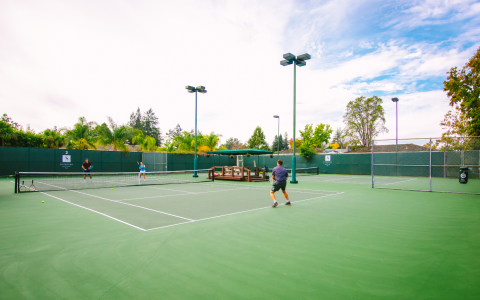 Players during a game of tennis out on the courts